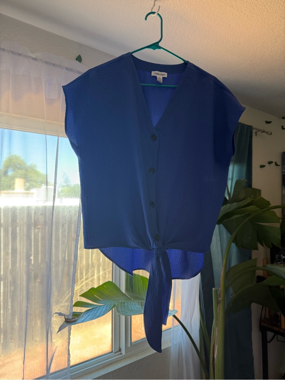 Calvin Klein V neck tie blue top